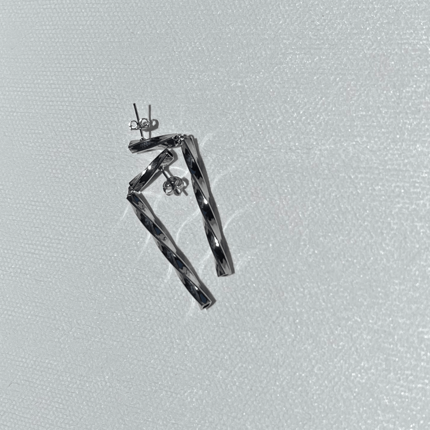 Cosmic Curve Rhodium Earrings - Rosetta Riwari